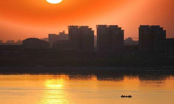 Setting Sun over the Waves, the North Water Gate and Huibo Tower